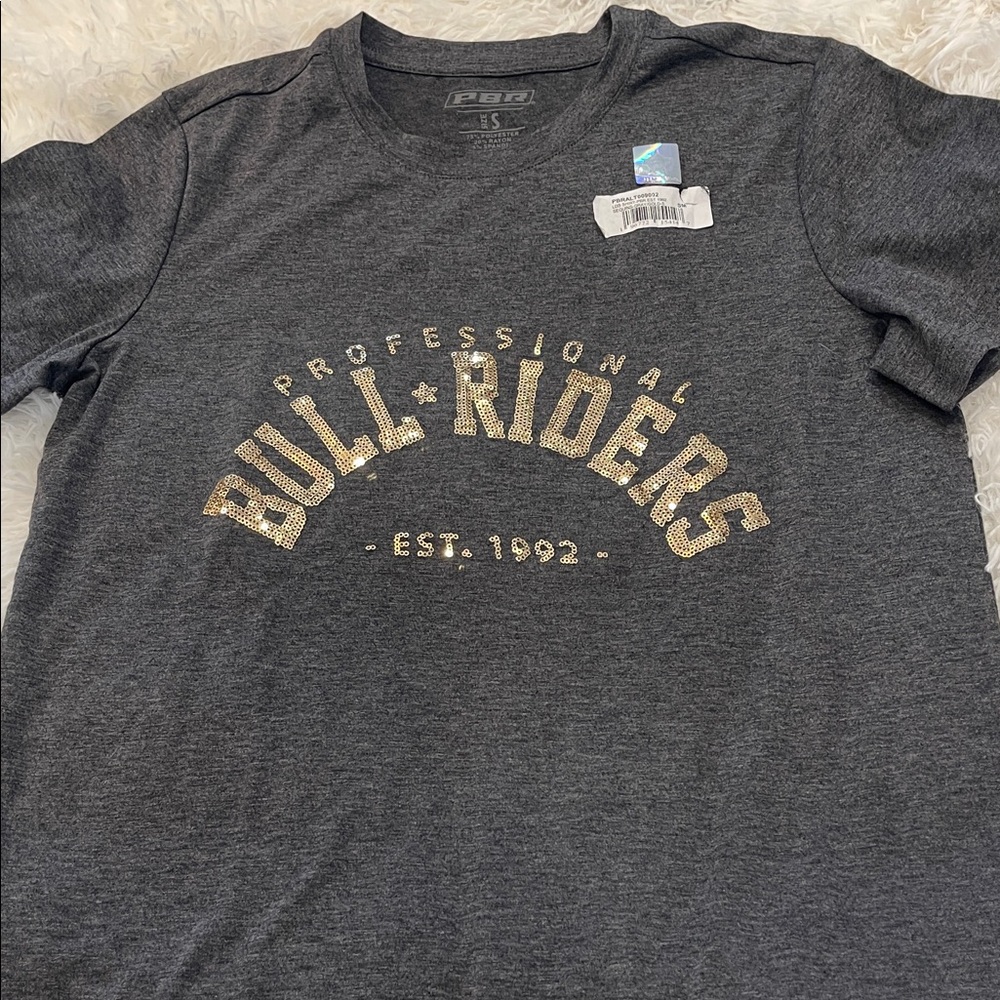 NWT Professional Bull Riding dark gray with gold sequin t-shirt. Size S